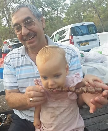 With his baby granddaughter